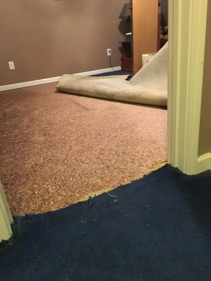 Carpet pad removal revealing water damage during Drying & Dehumidification in Chubbuck
